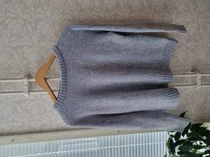 The sweater from Cubus, it was used a few times, light blue colour.