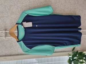 New training t-shirt  - The T-shirt is new and made of nice light fabric. I don't know the brand since it was a gift from Brazil.