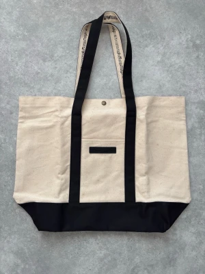 Number (N)ine X Marlboro Tote Bag - 📏 Measurements: height 35cm, width 45cm  ♻️ Condition: 10/10 Brand new without tags The darker spots on the bag may seem like stains, but they are actually a part of the design  🧵 Material: not 100% sure, but I would assume it's cotton  📸 Details: leather tag on the front, music note design on the handles, one pocket on the inside and one on the outside