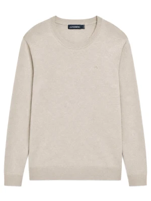 Beige stickad tröja från J.Lindeberg - Klassisk beige stickad tröja från J.Lindeberg merinoull med rund halsringning och diskret logga på bröstet. Tröjan har långa ärmar och ribbade muddar vid ärmslut och nederkant. Perfekt basplagg i mjukt material.