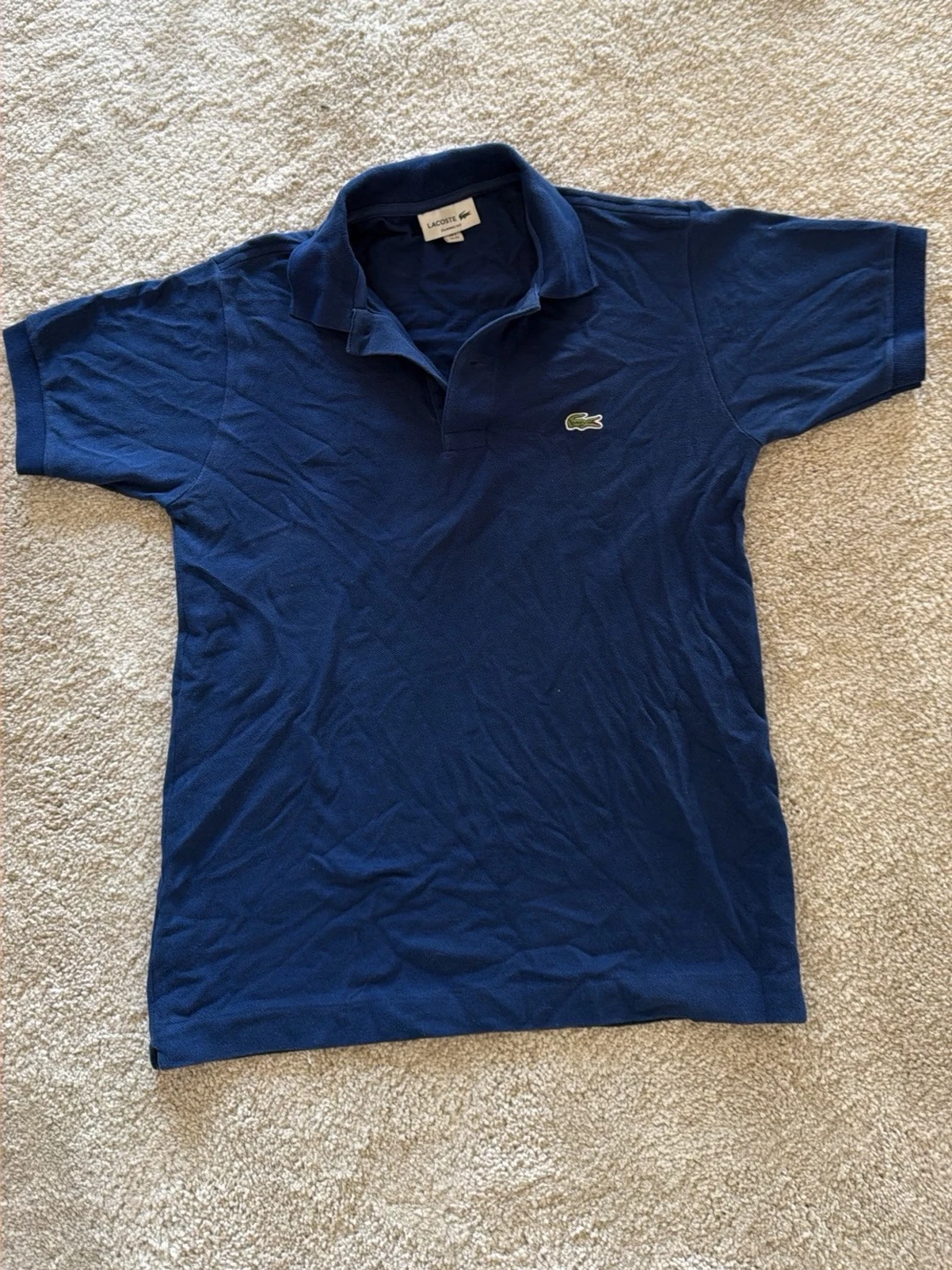 Blå pikétopp från Lacoste