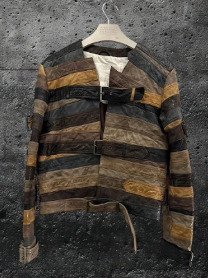 Maison Margiela X H&M belt jacket - Perfect condition with no flaws. The jacket has been extremely well kept and there are truly very few examples available that are even close to this condition. Bag and hanger included. This is one of the most iconic pieces from the Maison Margiela x H&M collaboration. The belt jacket has been worn by the likes of Young Thug and Lil Yachty and is widely recognized as a cult grail in both fashion and music culture. Measurements Length 61 cm Width 51 cm sleeve length 63.5cm