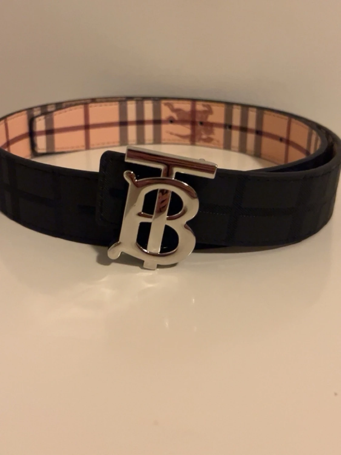 Svart Bur bälte med silver logga, reversible