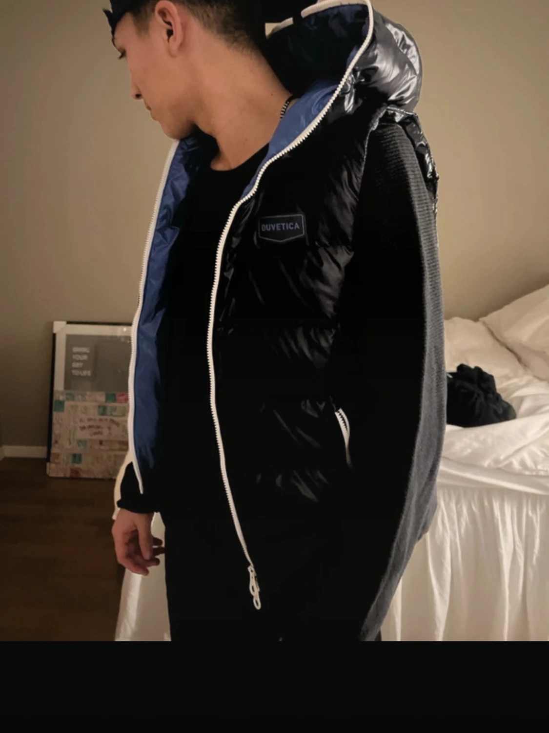 Svart dunväst från Duvetica med huva