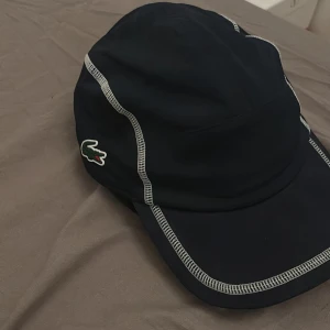 Lacoste keps - Oanvänd.