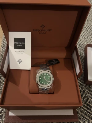 Patek Philip Nautilus  - Brand new Patek Philip green dial Nautilus with whole sets. Automatic mechanical watch, 41mm dial diameter, butterfly clasp. Best quality. Dm for more watches. 