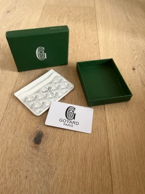 White Cardholder - White G cardholder. Never used. Brand new. 