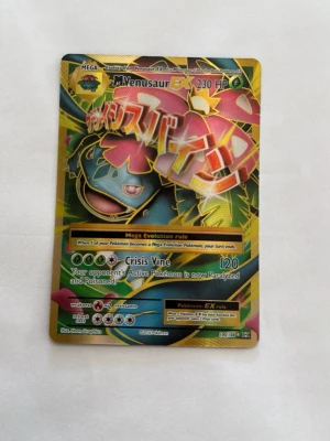 Pokémonkort Mega Venusaur EX - Säljer ett samlarkort från Pokémon, Mega Venusaur EX 100/108. Kortet har en färgstark och glansig design och är perfekt för dig som gillar Pokémon eller samlar på trading cards. Bra skick som man kan se på bilderna. Pris kan diskuteras. Hämtas i Torslanda eller så fraktar jag.