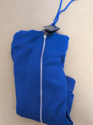 Ralph Lauren hoodie - Got a blue hoodie for sale. Size small. It's clean and in good shape. Super soft and cozy. Great for just hanging out or running errands. Looking for a quick sale, so hit me up if you want a better price.