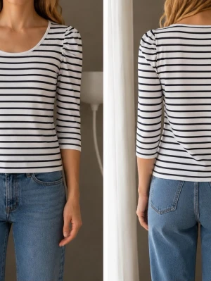 Randig topp med puffärm från Gina Tricot - Säljer en vit och svart randig topp från Gina Tricot med puffade axlar och trekvartsärm. Toppens passform är normal och den har en rund halsringning. Perfekt att matcha med jeans eller kjol för en snygg look.passar xs-m