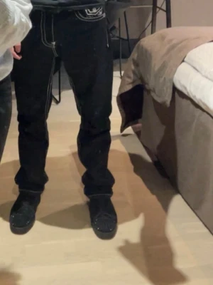 True Religion Jeans - The legs of the jeans are worn out.
