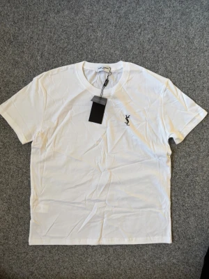 YSL white T shirt - Size M. true to size, very comfy and fits nice. Questions DM. Unisex