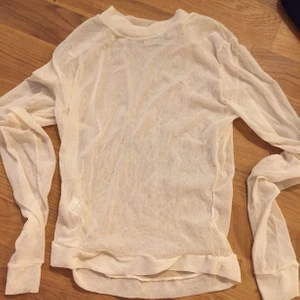Beige mesh tröja - storlek XS, oanvänd, köpare står för frakt