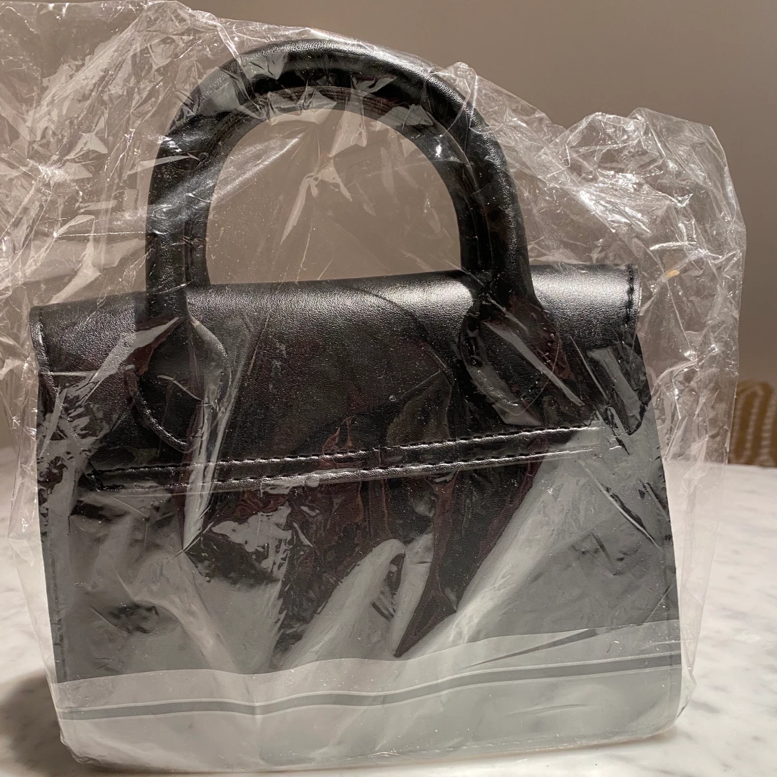 Handväska oanvänd - 91