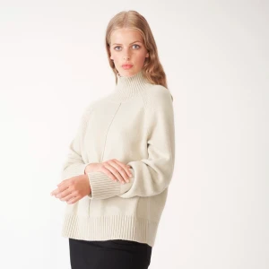 Stickad från Carin Wester - Supermysig stickad från Carin Wester. Finns fortfarande att köpa på Åhléns för 499. Passar alla storlekar, (är själv S-M) :)