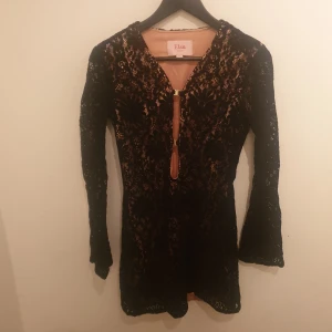  - Black, sexy, elegante, dress, Very comfortable and quite electomy material, Transparent black, Draw body and curves. Bought last year and never worn.. 