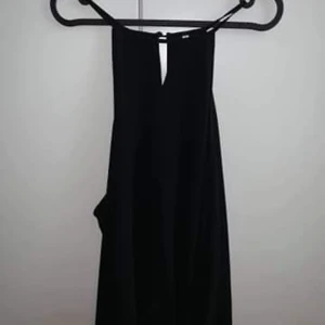 En svart tunika, aldrig använd - Storlek S/M