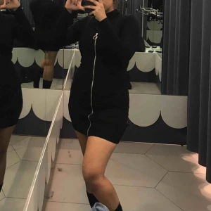  - Black sleeveless dress