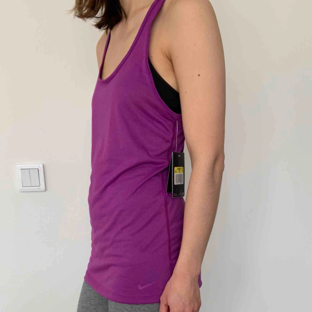 Nike Dry Fit tank top Brand: Nike Size: S Colour: Purple  Never worn. Still has tag. 2 years old.. Toppar.