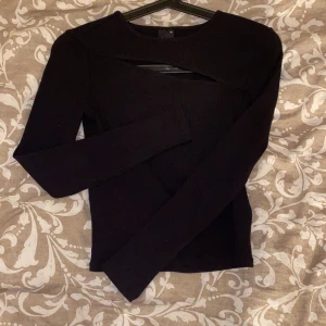 Svart långärmad - Oanvänd topp i storlek Xs. Nypris 199kr