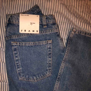  - Brand new American Apparel High waist jeans.    Size 28. :))