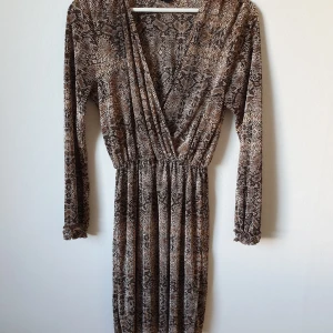 Snake print mini dress - NEW River Island snake print mini dress - size 40- 14 , can work for M-L 