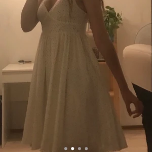 White dress with small stars  - The dress is a size xs and quite stretchy. The skirt is also quite poofy 