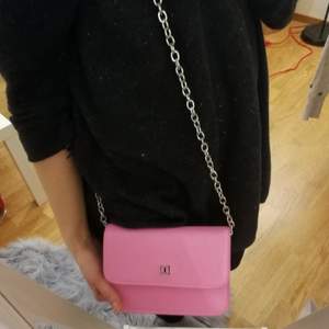 A cute pink clutch from Don Donna