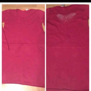  - Oanvänd klänning men justerbar midja och en fjäril av små diamanter på ryggen  