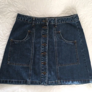  - Short denim skirt