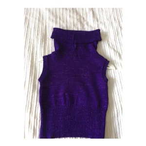  - Purple turtle neck top; beautiful with skinny trousers and heels 