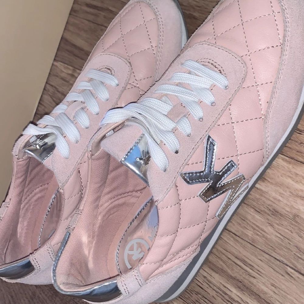 super fine shoes, purchased in Canada.  comfortable to wear and they are genuine/NOT FAKE.  It is pink leather with MK brand in silver.  used once and nothing is wrong with Them.  size 38 and comes with Michael kors package. Skor.