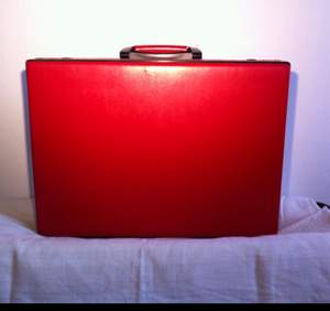 Red leather travel office brief case with lock.