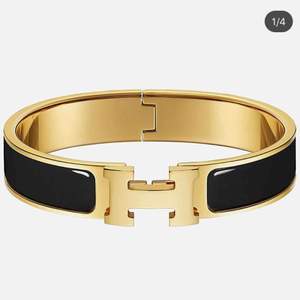 Hermes armband i svart och guld 