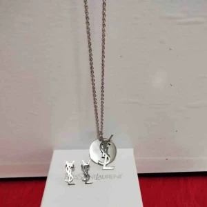  - Ysl i rostfritt stål.. ny med box