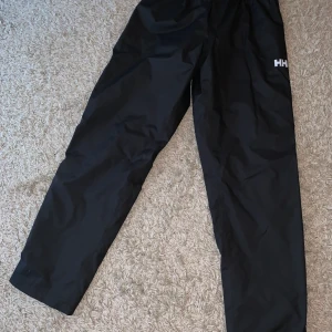 Helt hansen - Helly Hansen regn byxor , (Nyskick)