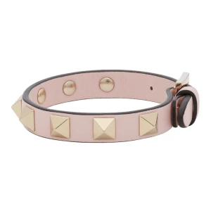 Armband från Valentino - Valentinoarmband i rosa med guldiga nitar, superfint skick och inte alls slitet!! 