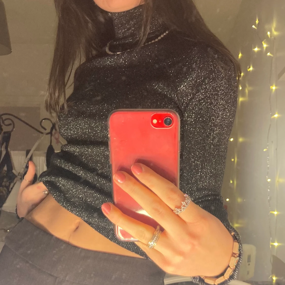 Svart glittrig stickad polotröja