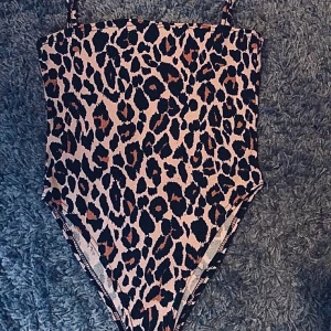 Leopard body  - Aldrig använd , storlek M 
