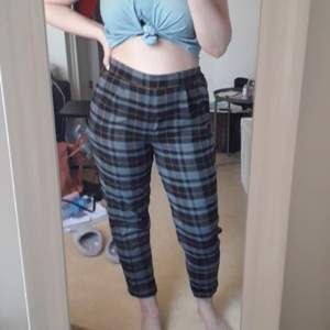 A pair of check trousers from pull and bear. They have an elasticated waist at the back. Fits more like a medium. They're a bit too tight for me.
