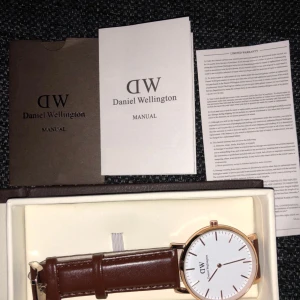  -  Brand new Daniel Wellington leather straps with box and menu book 