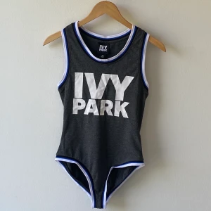 Ivy Park grey bodysuit - Ivy Park grey bodysuit. Colored trims and logo print on the chest. Size XS (size big, good for size S as well). Very good condition, worn only once.