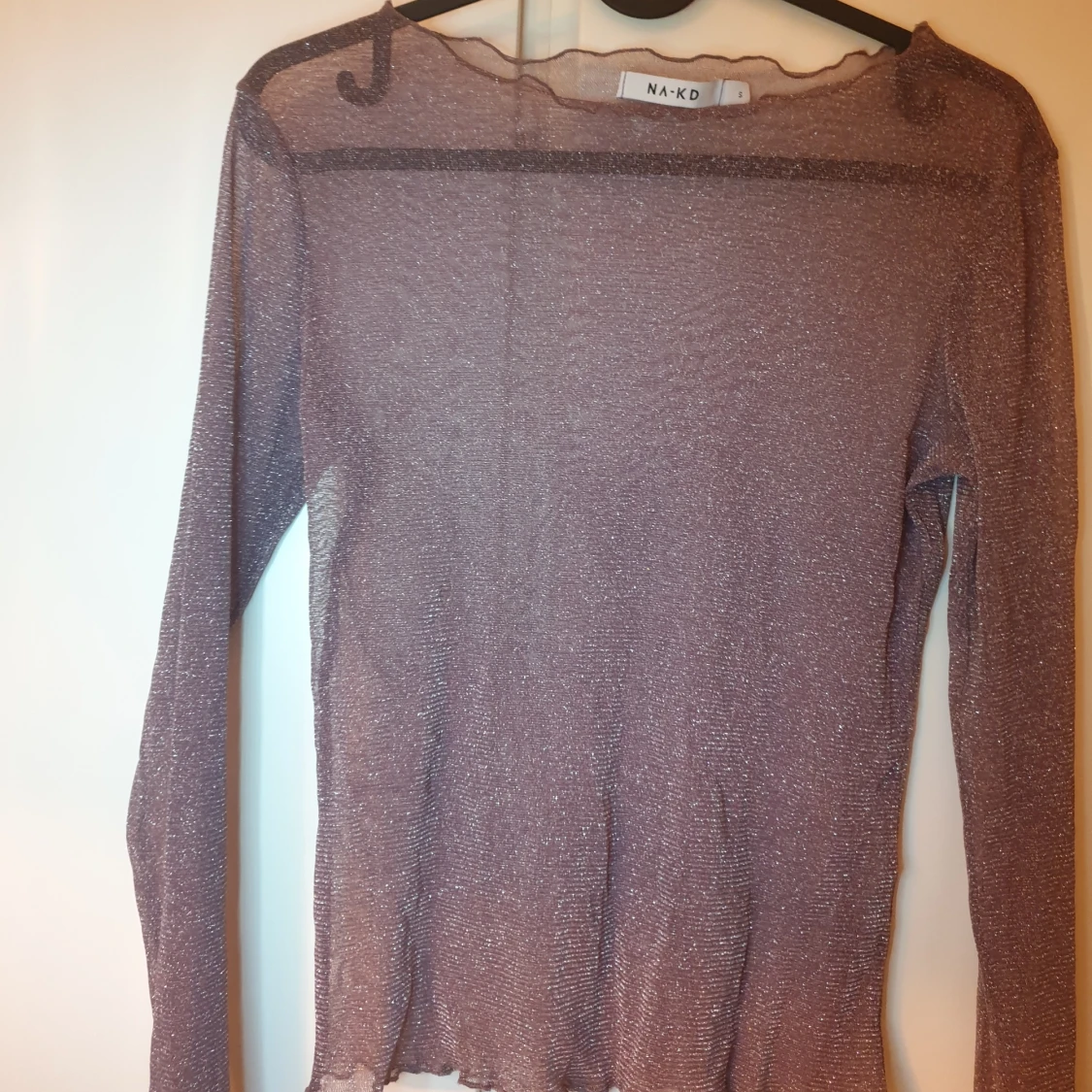 Lila glittrig genomskinlig tröja