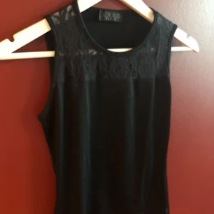  - Black top with cute lace on the top by the collar; small M, suits S size as well 