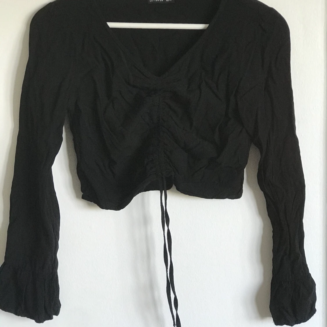 Midjetopp med knytning 