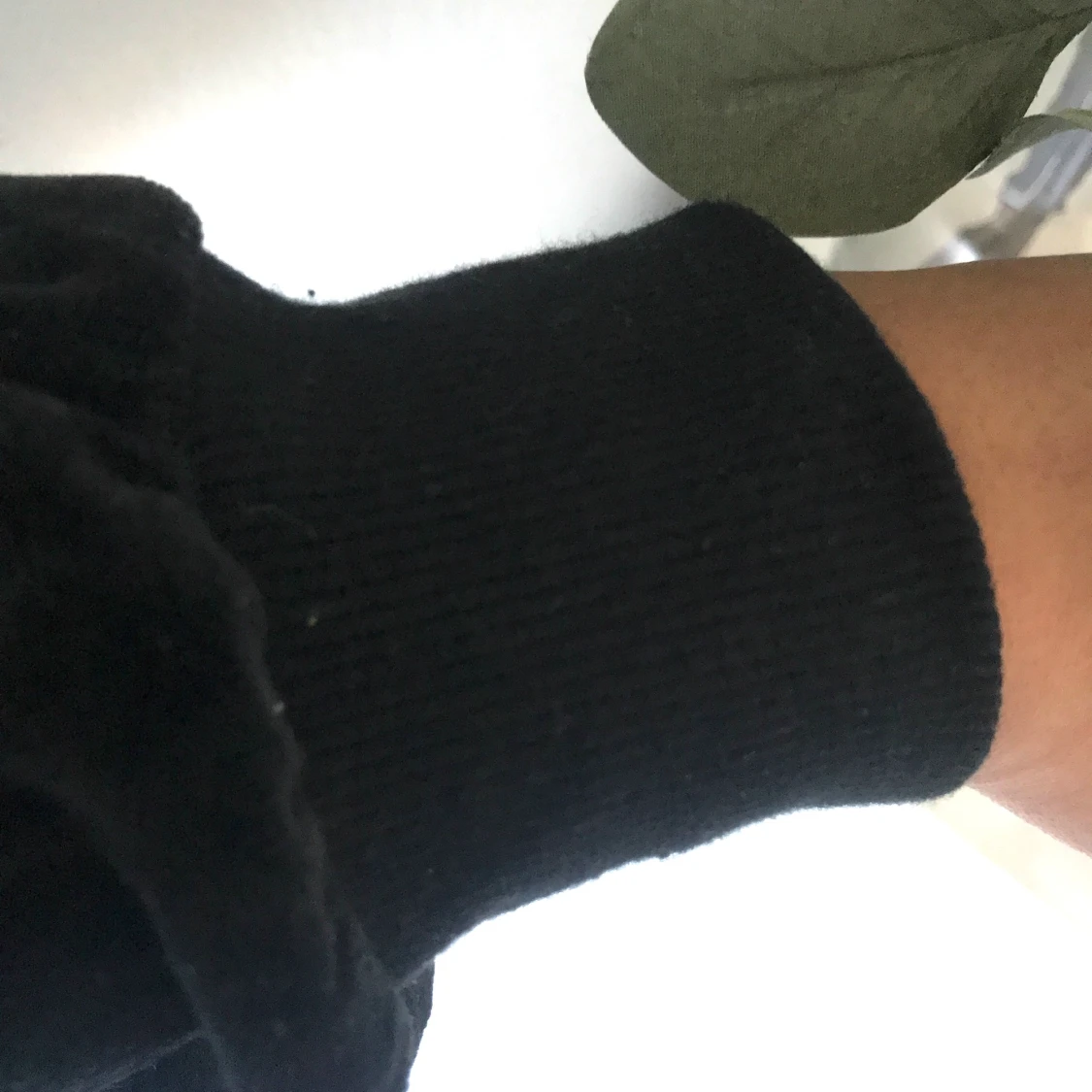 En svart kofta med dragkedja - 90