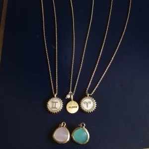 Halsband och hänge - ALLT 60kr - Endast halsbandet från Pilgrim (mindre guld på visa ställen på halsbandet) är använt och den blåa stenen. Paketpris för alla 60kr