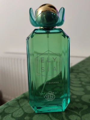 Fragrance World Elysia Sweet Banana  - Fragrance World Elysia Sweet Banana, ca 97-98ml ml kvar av 100. Skickar gärna med en gratis parfymsplitt vid köp.