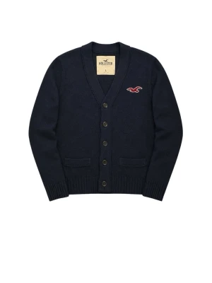 Mörkblå cardigan från Hollister - Snygg mörkblå cardigan från Hollister med knappar framtill. Hollister loggan på bröstet, skick 9/10, hör av dig vid fundering