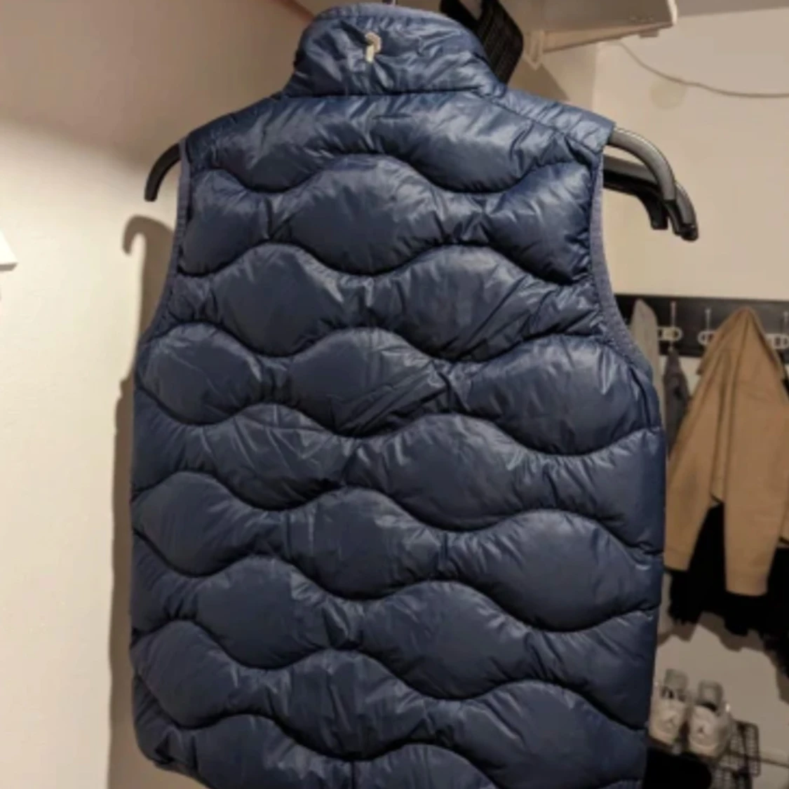 Blå dunväst från Peak Performance, strl 150 - 90